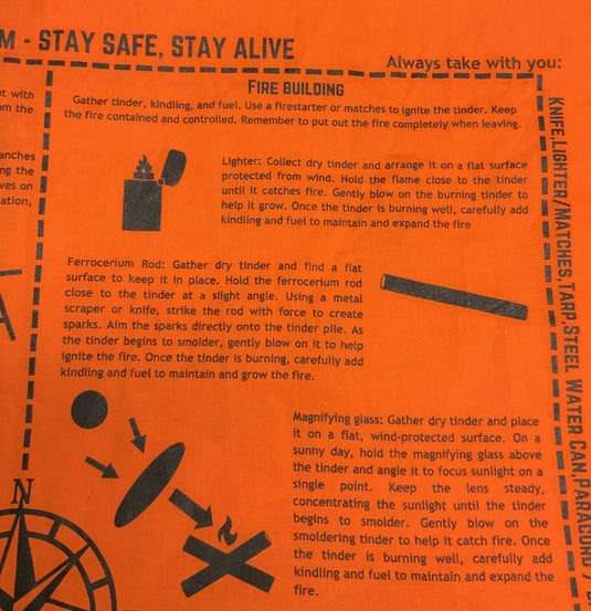 SurvivalRags orange survival bandana full view flat lay on grass showing all printed survival instructions